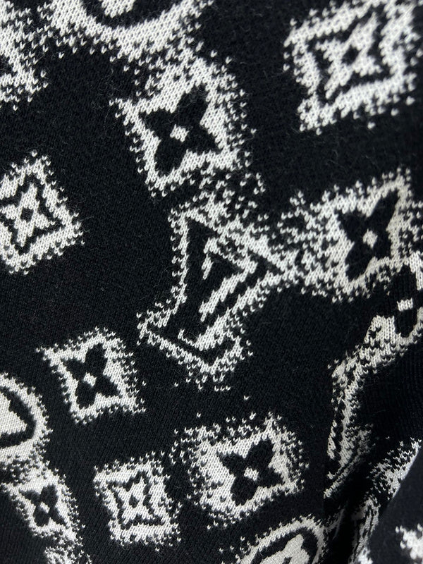 Flat lay presentation of Louis Vuitton luxury clothing with logo-detail design