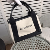 Handle and strap detail of structured everyday-luxe women's handbag – women's everyday handbag