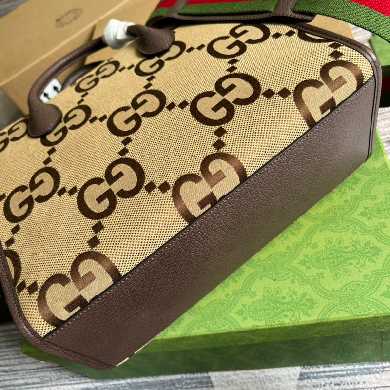 Styled lifestyle shot of signature statement women's handbag – women's luxury handbag