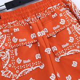 Back view of Rhude luxury clothing with monogram-inspired silhouette
