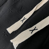 Close-up detail shot of Louis Vuitton luxury clothing with tailored silhouette