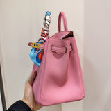 Side view of streamlined structured handbag