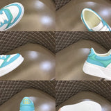 Side profile of Gucci fresh white-and-black sneakers sleek tonal finish