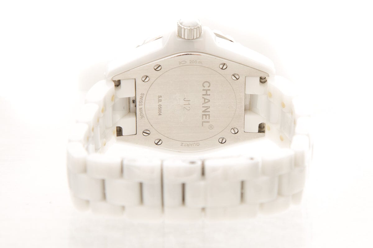 Close-up detail view of Chanel unisex white watch