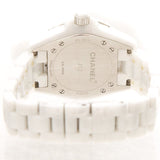 Close-up detail view of Chanel unisex white watch