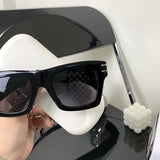 Close-up detail view of Louis Vuitton unisex sunglasses