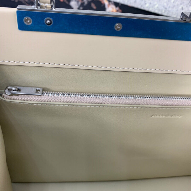Front view of sleek modern women's handbag – women's luxury accessory