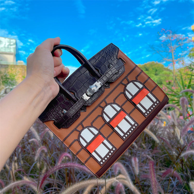 Side view of minimalist structured handbag