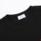 Close-up detail shot of Rhude luxury clothing with label-forward styling