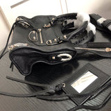 Back view of elevated polished women's handbag – women's luxury accessory