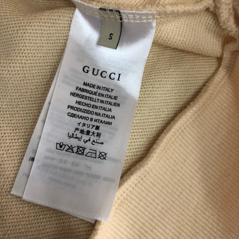 Side profile of Gucci luxury clothing with relaxed-fit cut