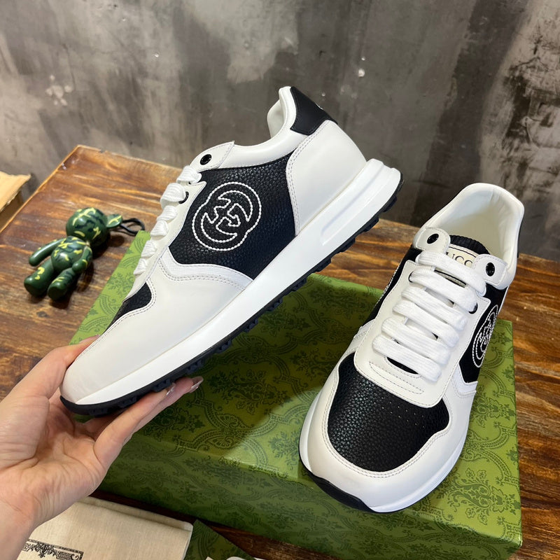 Side profile of Gucci fresh white-and-black sneakers signature lace-up style