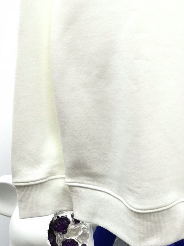 Close-up detail shot of Louis Vuitton luxury clothing with runway-inspired design