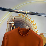 Close-up detail shot of Louis Vuitton luxury clothing with monogram-inspired silhouette