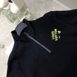 Flat lay presentation of Louis Vuitton luxury clothing with streetwear-inspired cut