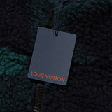 Close-up detail shot of Louis Vuitton luxury clothing with label-forward styling