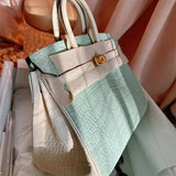 Side view of structured structured handbag