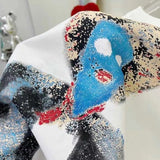 Close-up detail shot of Louis Vuitton luxury clothing with runway-inspired design