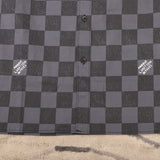 Close-up detail shot of Louis Vuitton luxury clothing with relaxed-fit cut