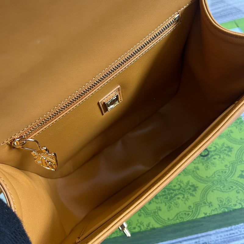 Side profile of signature classic women's handbag – women's luxury accessory