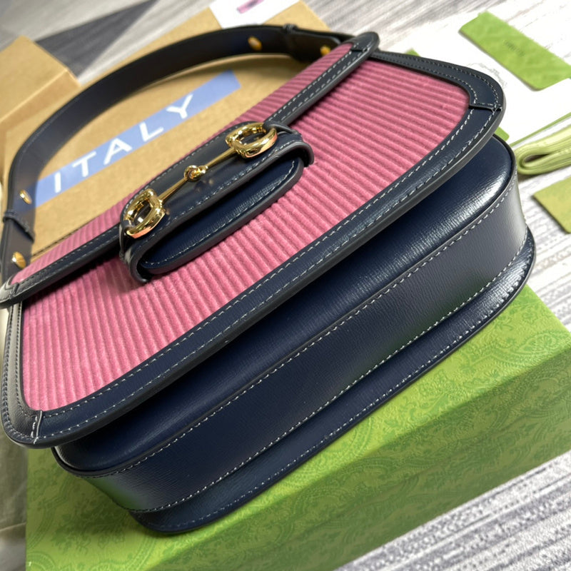Styled lifestyle shot of signature polished women's handbag – women's luxury accessory