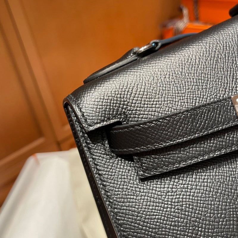 Side view of sculpted structured handbag