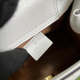 Side profile of classic refined women's handbag – women's statement bag