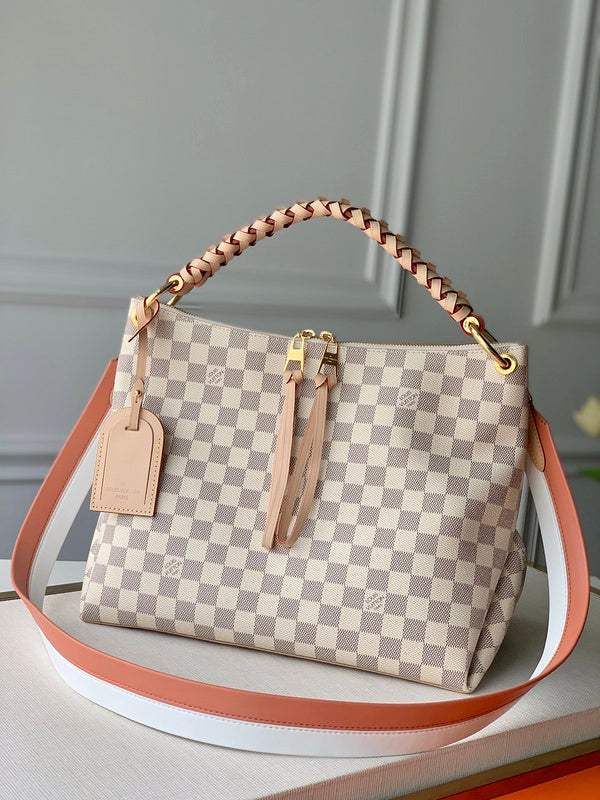 Handle and strap detail of classic everyday-luxe women's handbag – women's everyday handbag