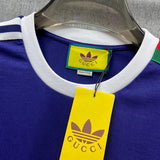 Close-up detail shot of Gucci luxury clothing with logo-detail design