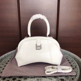 Handle and strap detail of elevated modern women's handbag – women's statement bag