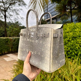 Side view of contemporary structured handbag