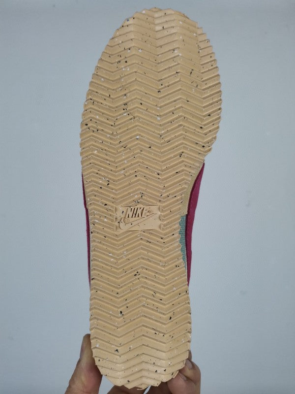 Side profile of Nike neutral cream sneakers breathable knit upper