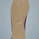 Side profile of Nike neutral cream sneakers breathable knit upper