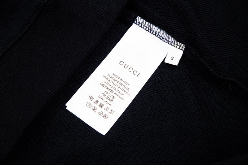 Close-up detail shot of Gucci luxury clothing with relaxed-fit cut
