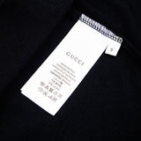 Close-up detail shot of Gucci luxury clothing with relaxed-fit cut