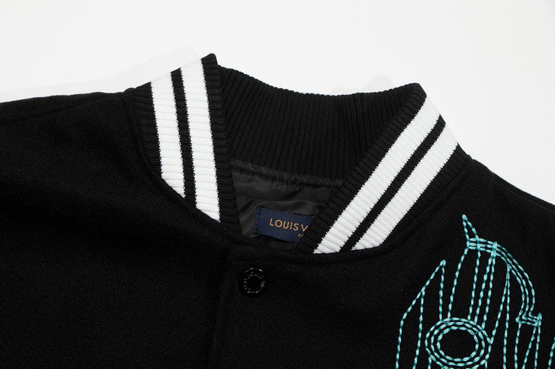 Close-up detail shot of Louis Vuitton luxury clothing with label-forward styling