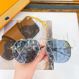 Close-up detail view of Louis Vuitton unisex sunglasses