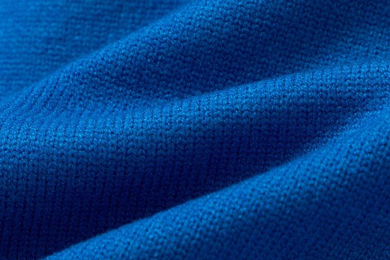 Close-up detail shot of Gucci luxury clothing with logo-detail design