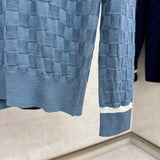 Back view of Louis Vuitton luxury clothing with signature branding