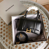 Front view of chic sleek women's handbag – women's luxury accessory