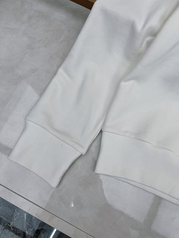Flat lay presentation of Gucci luxury clothing with logo-detail design