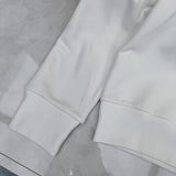 Flat lay presentation of Gucci luxury clothing with logo-detail design