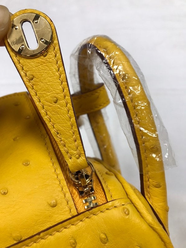 Side view of curated structured handbag
