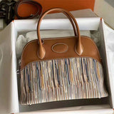 Side view of fluid structured handbag