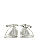 Close-up of Alexander McQueen sandals hardware and fine stitching