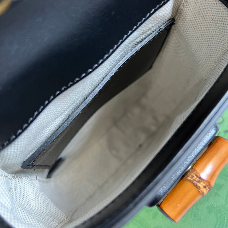 Close-up detail of sleek signature women's handbag – women's luxury accessory