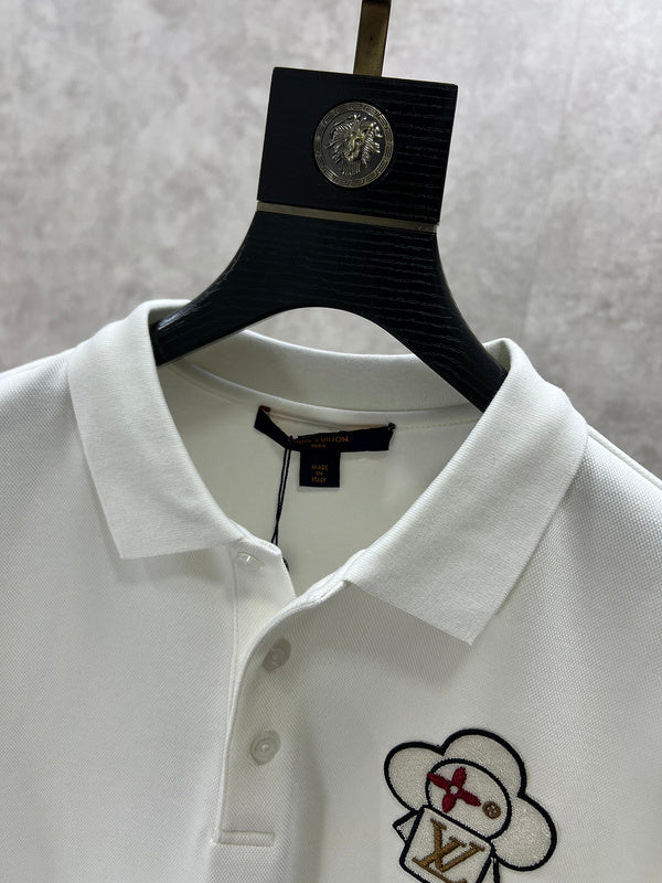 Close-up detail shot of Louis Vuitton luxury clothing with logo-detail design