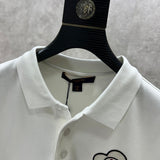 Close-up detail shot of Louis Vuitton luxury clothing with logo-detail design