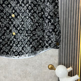 Back view of Louis Vuitton luxury clothing with label-forward styling