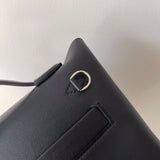 Side view of poised structured handbag